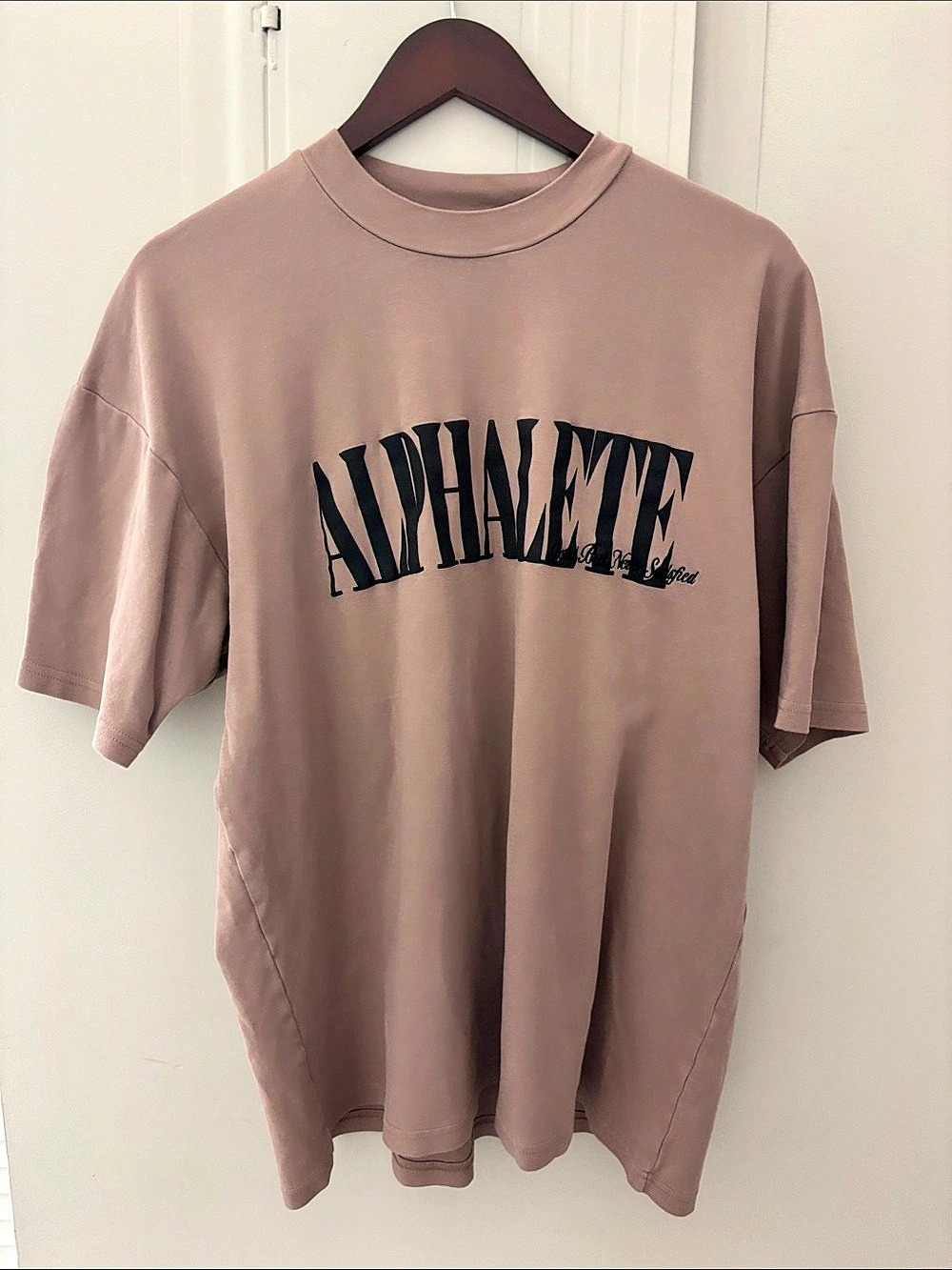 Alphalete Logo Tee Graphic Short Sleeve Tee Size Large tan with black text